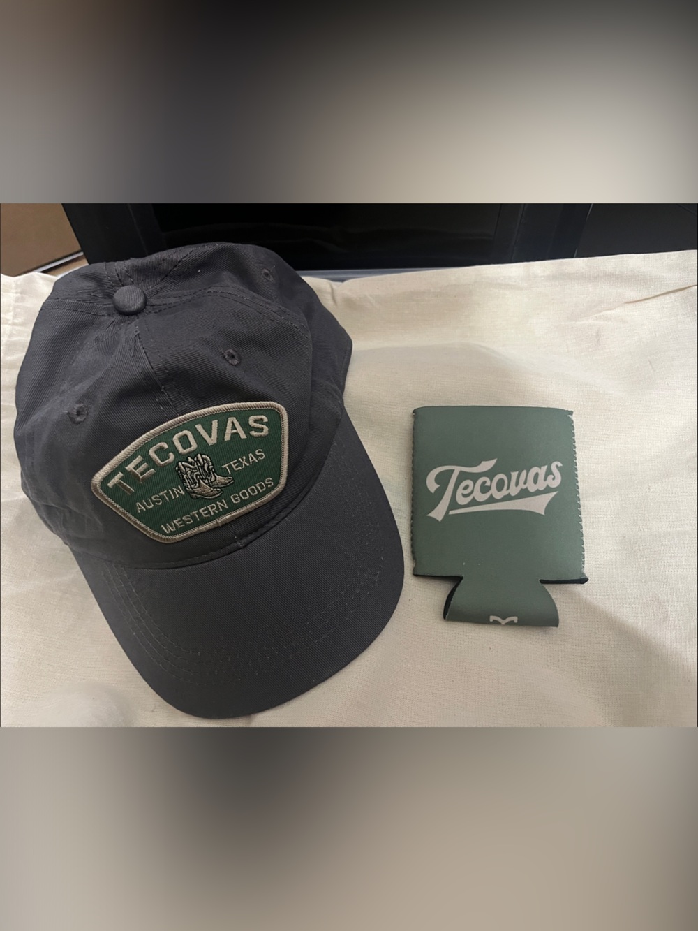 Tecovas Black Hat with Green Tecovas Koozie